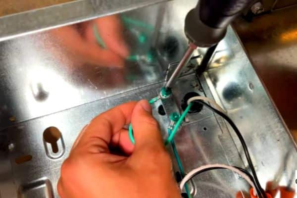 connecting the green wire to terminal box