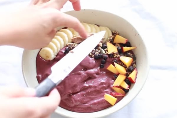 Add toppings on acai puree